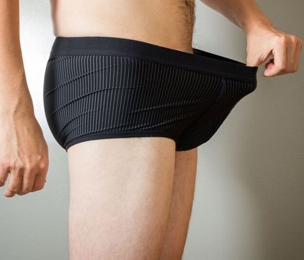 a man looks at his underwear after a penis enlargement operation